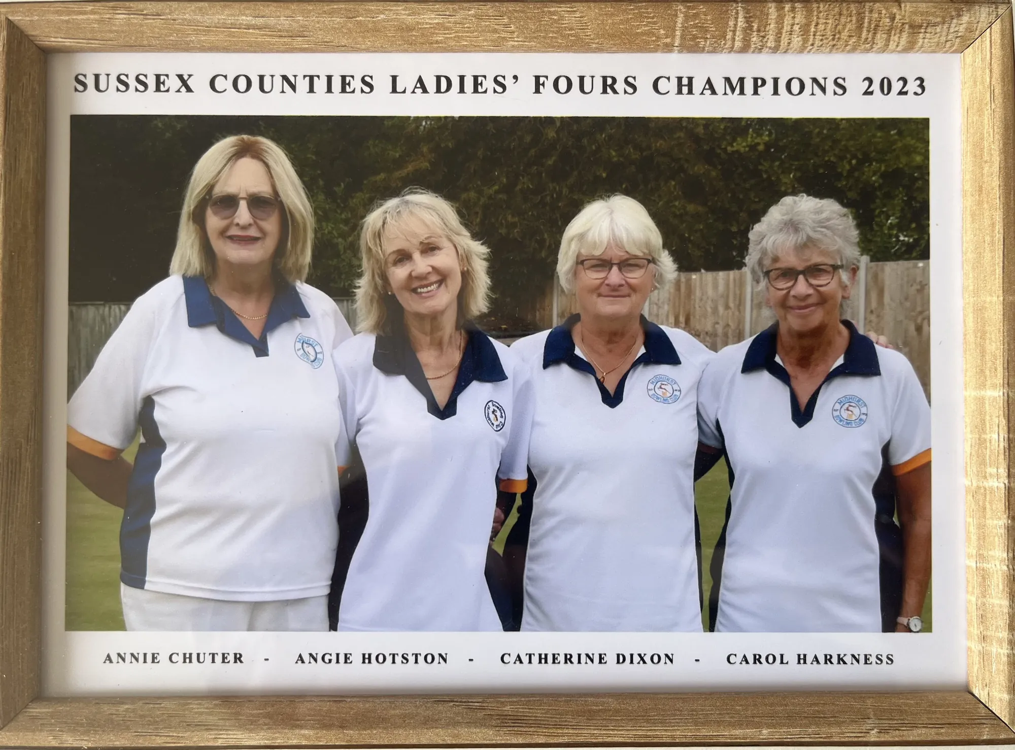 Framed photograph of the Midhurst Bowling Club Sussex Counties Ladies' Fours champions, hung at the club